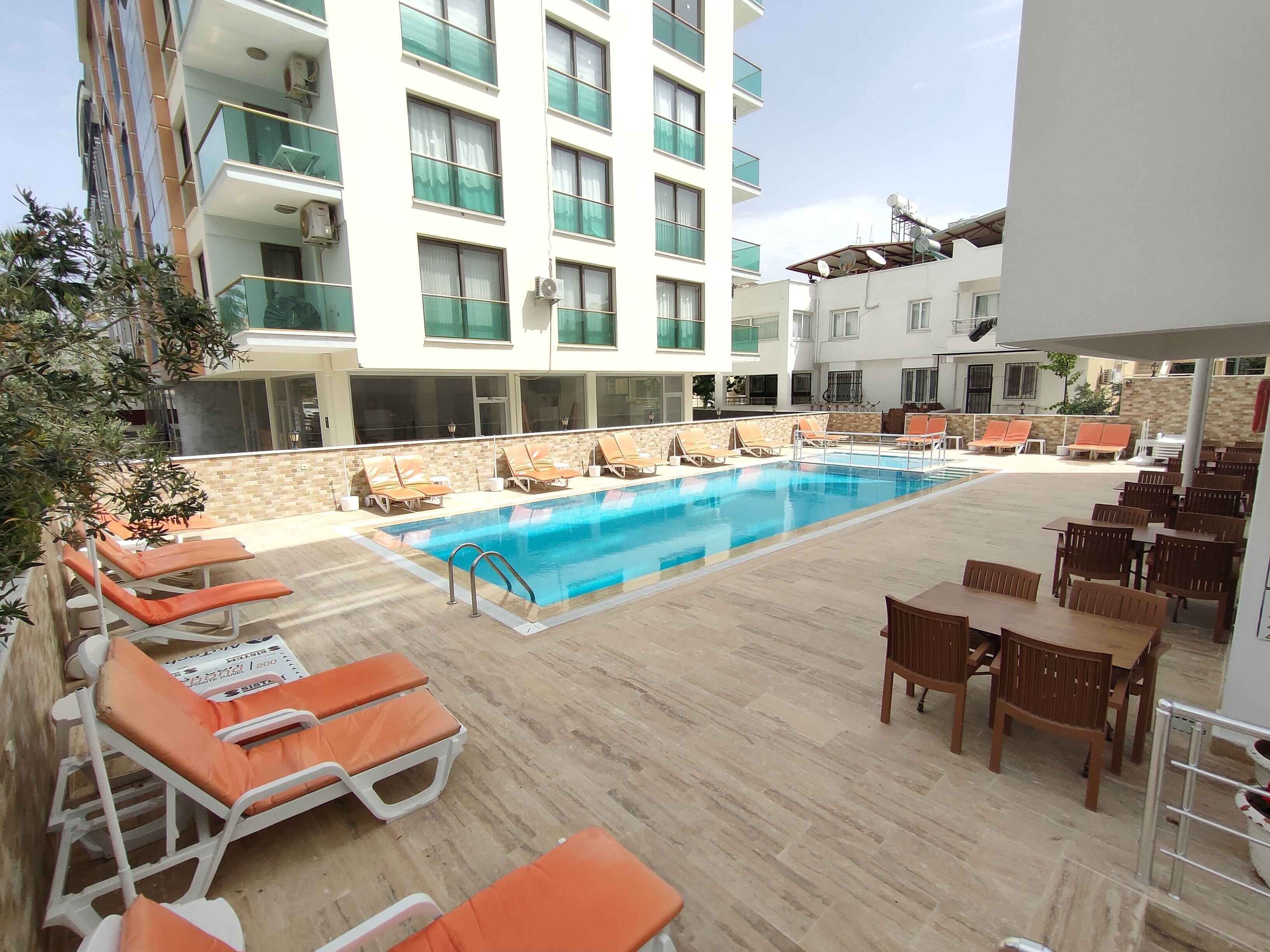 Outdoor pool, pool umbrellas, sun loungers