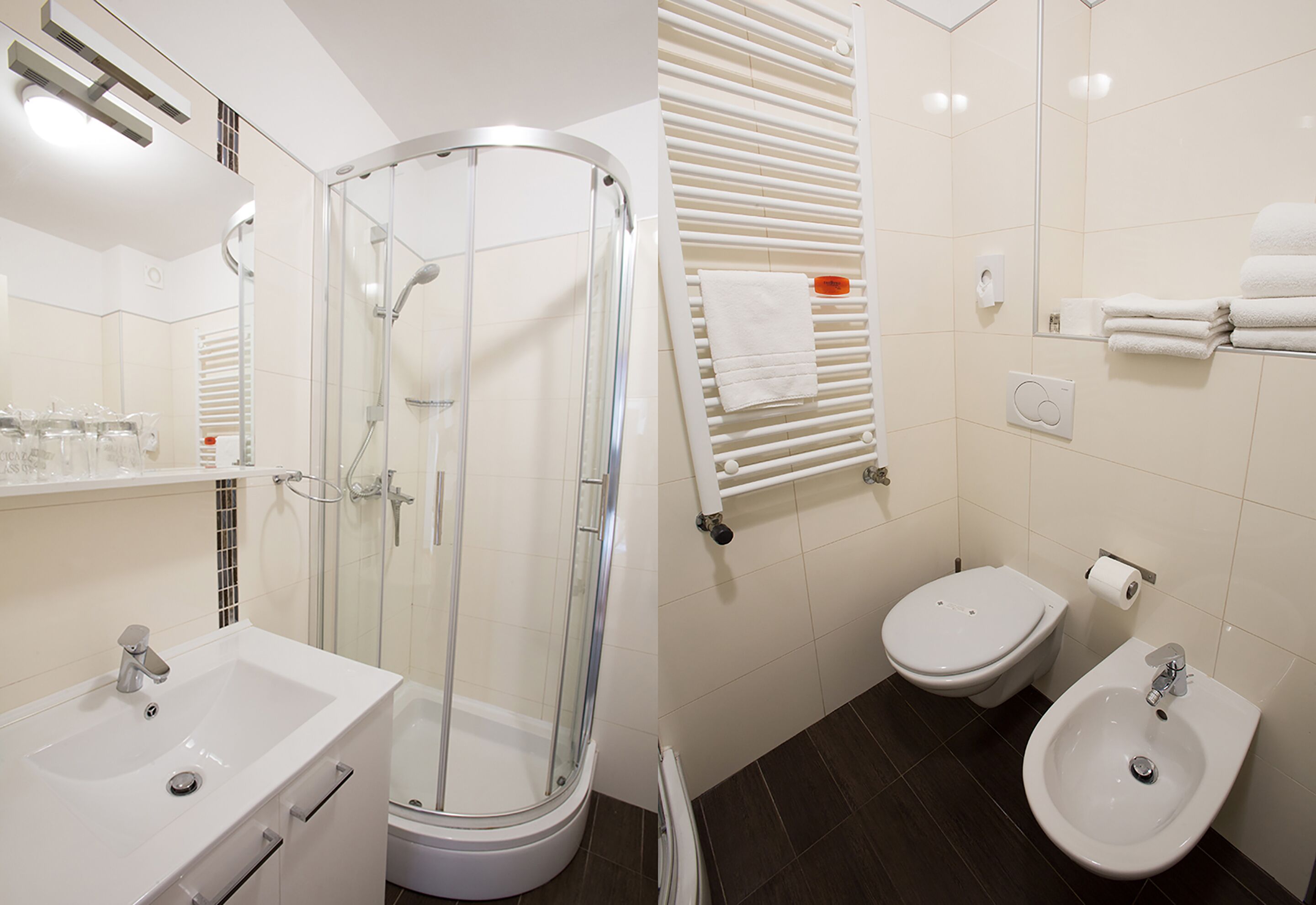 A modern bathroom with a glass-enclosed shower, a sink, a toilet, and a bidet.