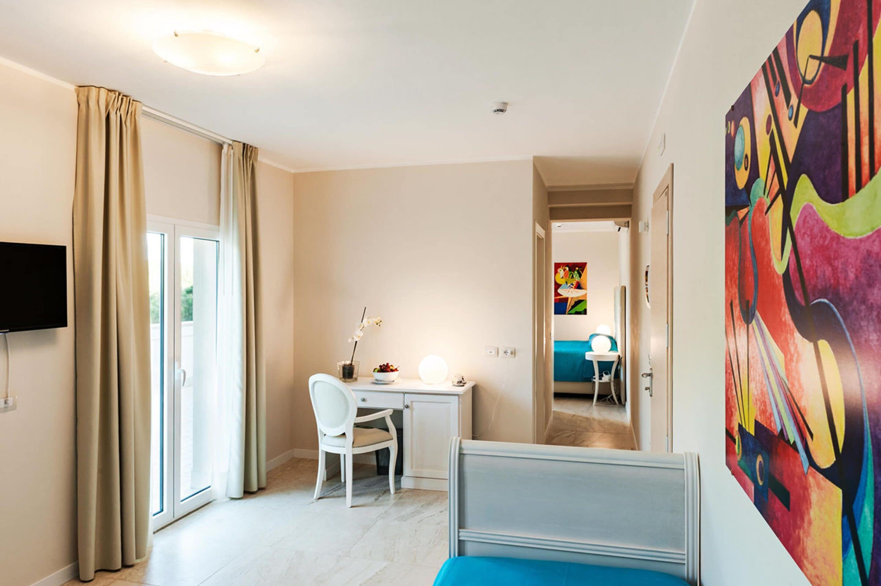 junior suite, terrace | minibar, in-room safe, desk, blackout curtains