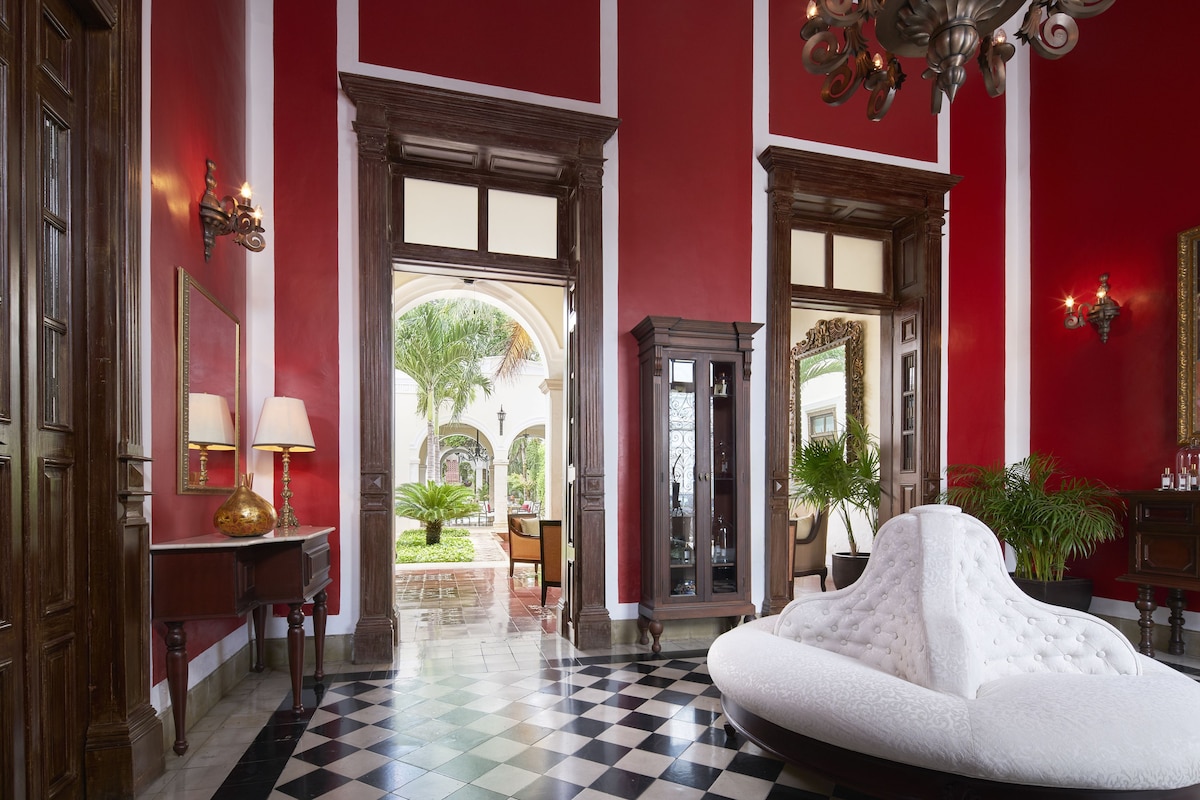 best hotels in merida mexico | rosas y xocolate exterior pink walls