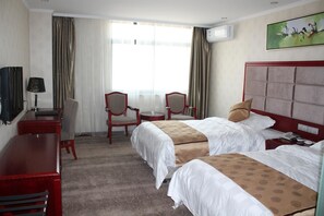 A hotel room with two beds, a desk, a chair, a TV, and a painting on the wall. - Super 8 Hotel (Hefei)