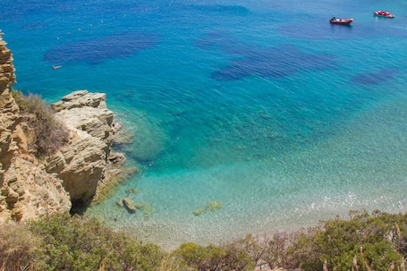 Private beach, sun loungers, beach umbrellas, beach towels. Peninsula Resort & Spa - All Inclusive