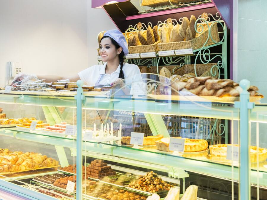 A bakery display case with various baked goods.