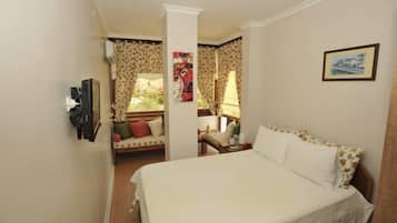 Double Room | Minibar, iron/ironing board, free cribs/infant beds, rollaway beds