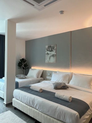 Junior Room, 1 Bedroom | Minibar, blackout drapes, soundproofing, iron/ironing board