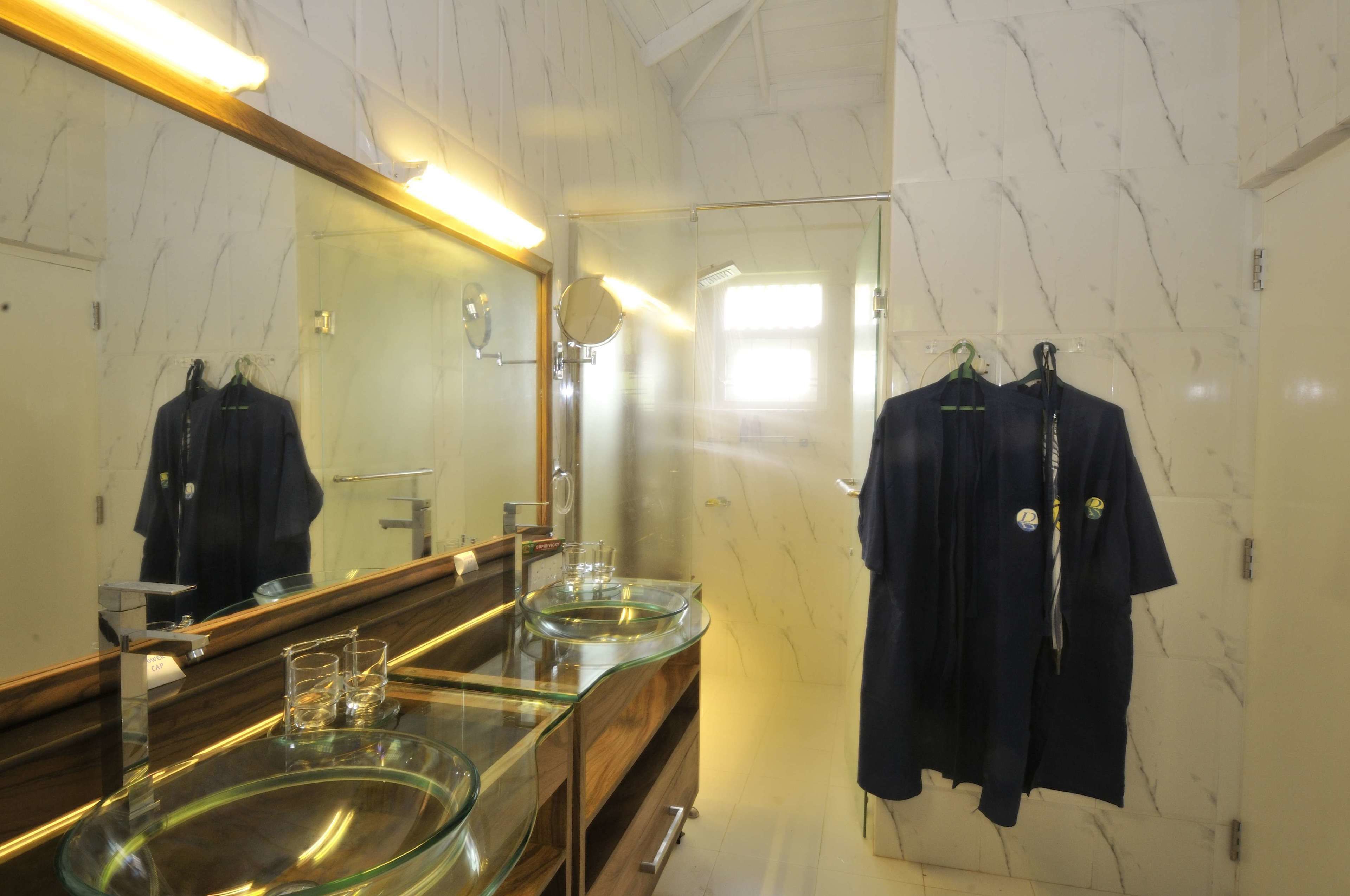 deluxe room | bathroom | shower, hair dryer, dressing gowns, towels