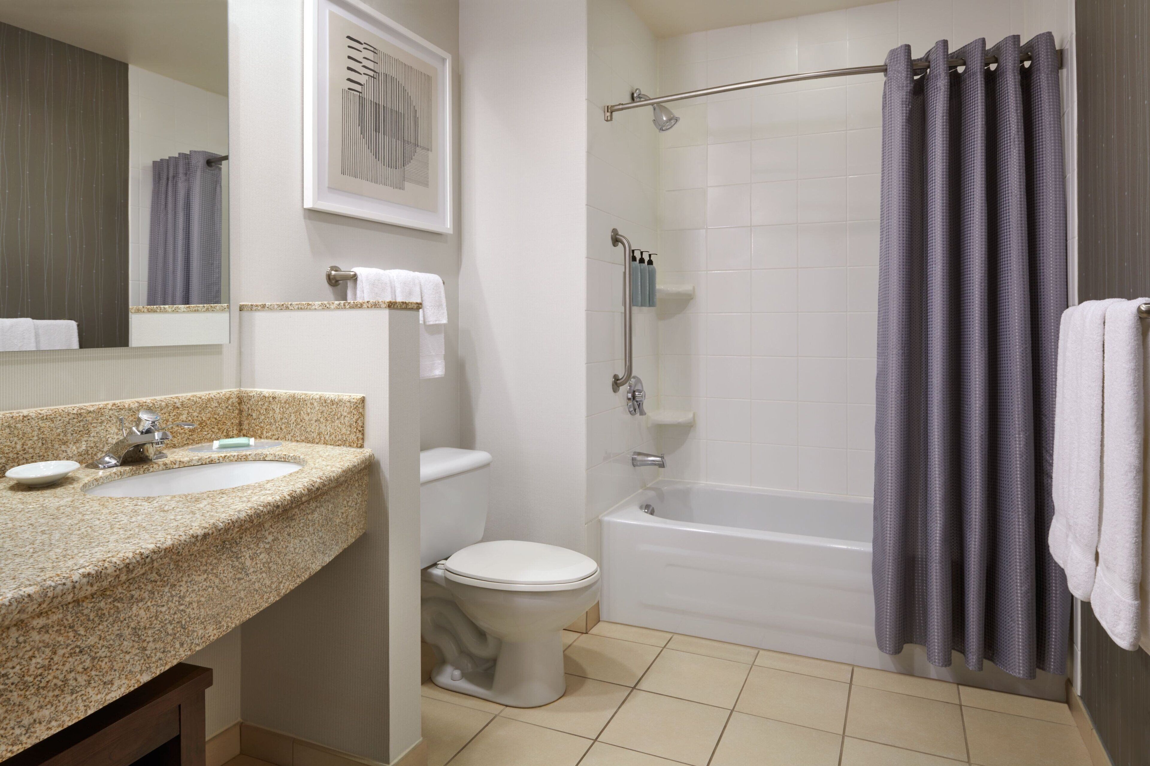 combined shower/bathtub, hair dryer, towels