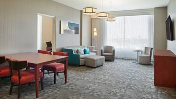 Suite, 1 Bedroom, City View, Corner | Living area | TV, pay movies