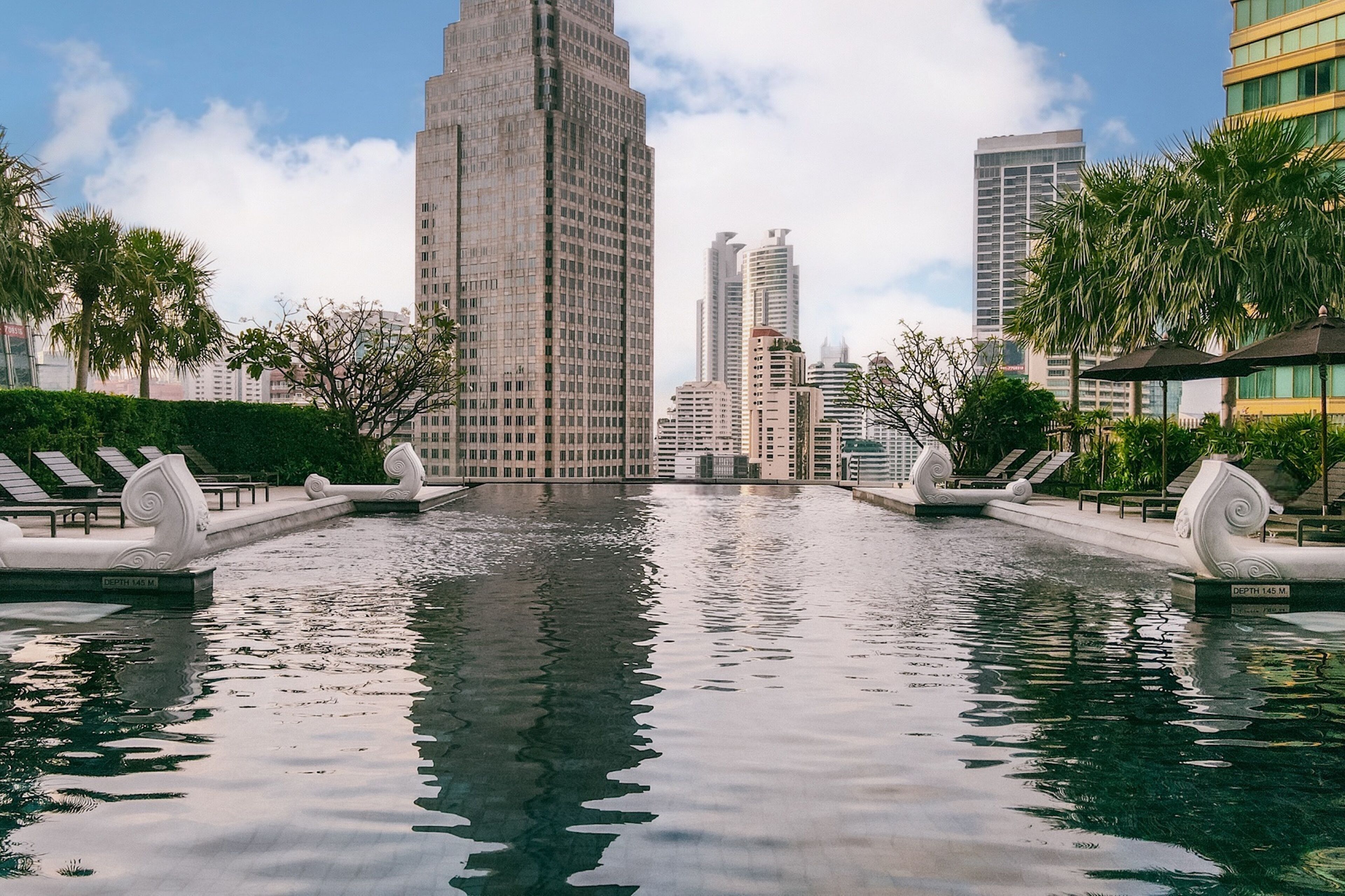 outdoor pool, pool umbrellas, pool loungers