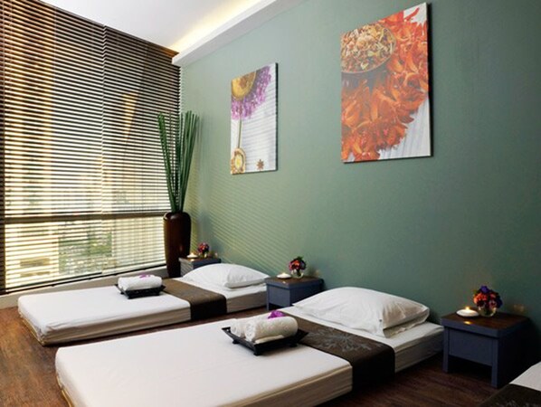 A room with two beds, a large window with blinds, a potted plant, and two wall-mounted paintings. - Grande Centre Point Hotel Terminal 21 (Bangkok)