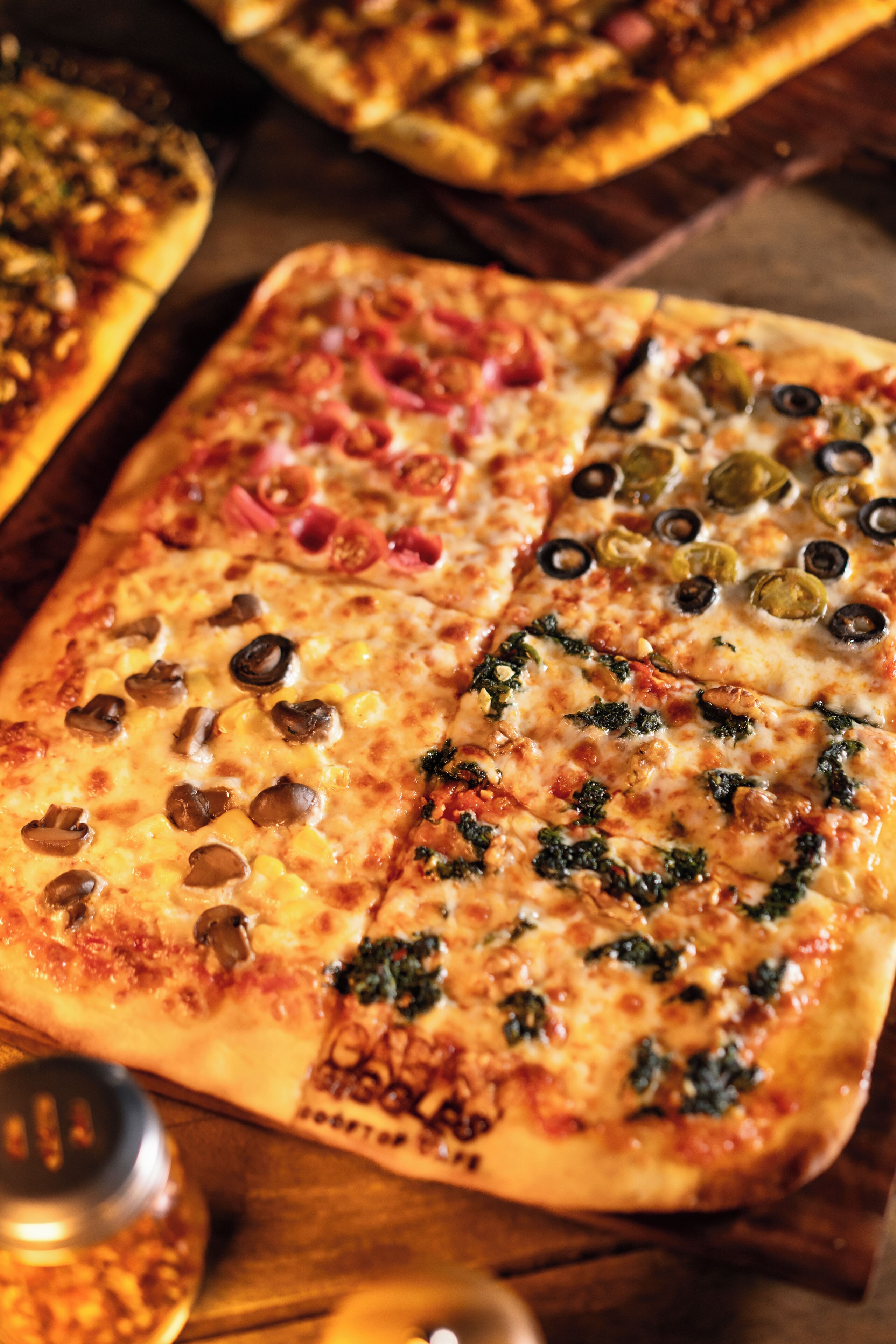 A pizza with various toppings.