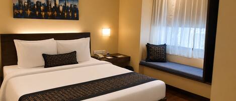 Suite, 1 cama King size | Ropa de cama de alta calidad y minibar