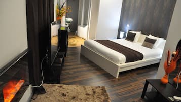 Junior suite | Een minibar, individueel gedecoreerd, verduisterende gordijnen