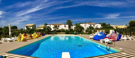 Seasonal outdoor pool, pool loungers