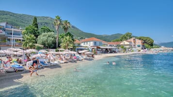 Private beach nearby, white sand, beach cabanas, beach bar