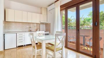 Deluxe Apartment, 1 Bedroom, Terrace | Private kitchen | Full-size fridge, stovetop, coffee/tea maker, electric kettle