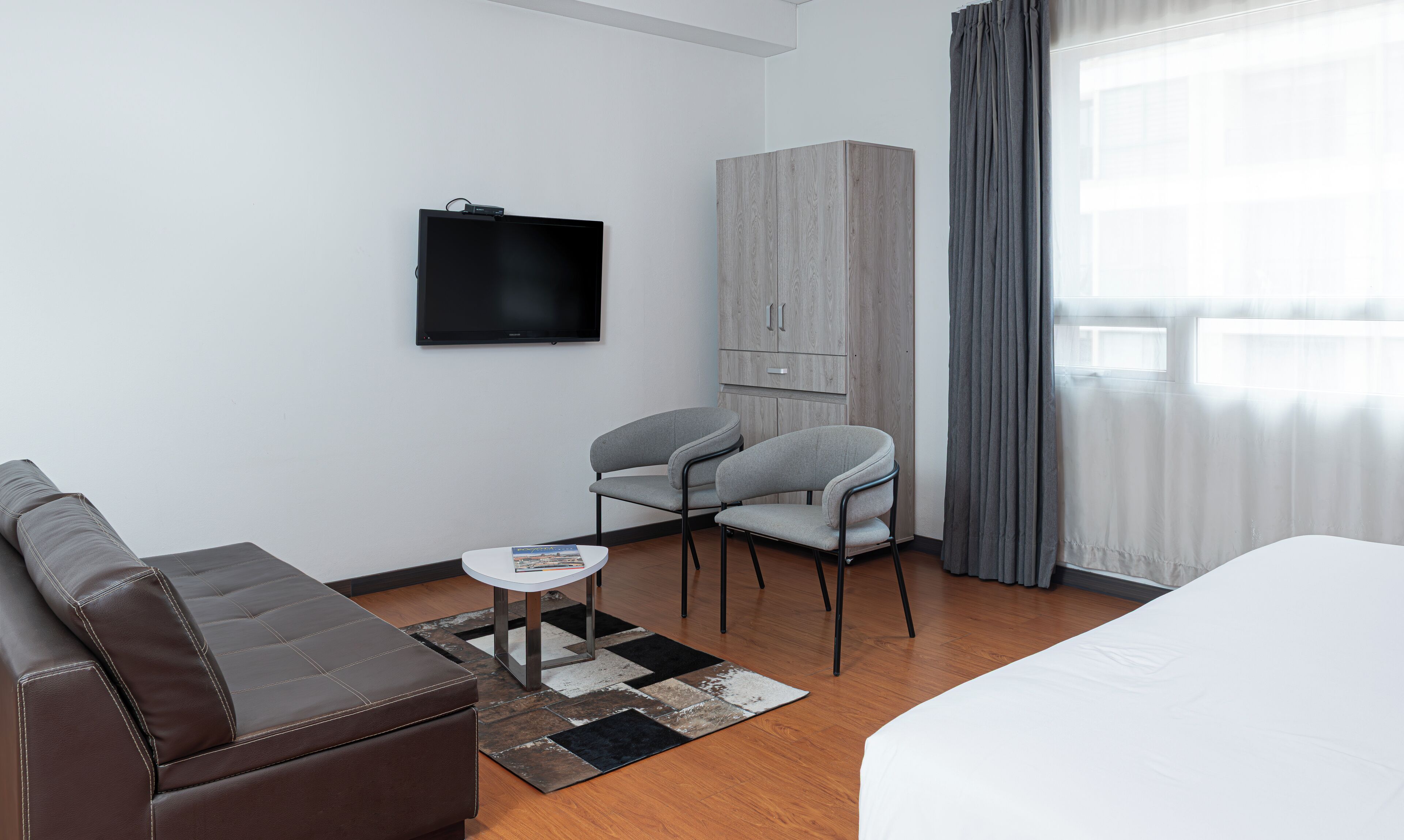 grand suite | living area | 32-inch flat-screen tv with cable channels, tv