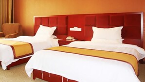 A hotel room with two beds, a red headboard, and a bedside table with a phone. - Super 8 Hotel- Jinan Coach Station Branch (Jinan)