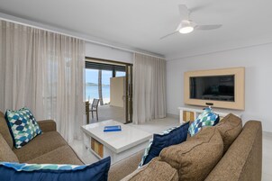 Three Bedroom Duplex Apartment with Patio | Living area | 42-inch flat-screen TV with satellite channels, TV, table tennis