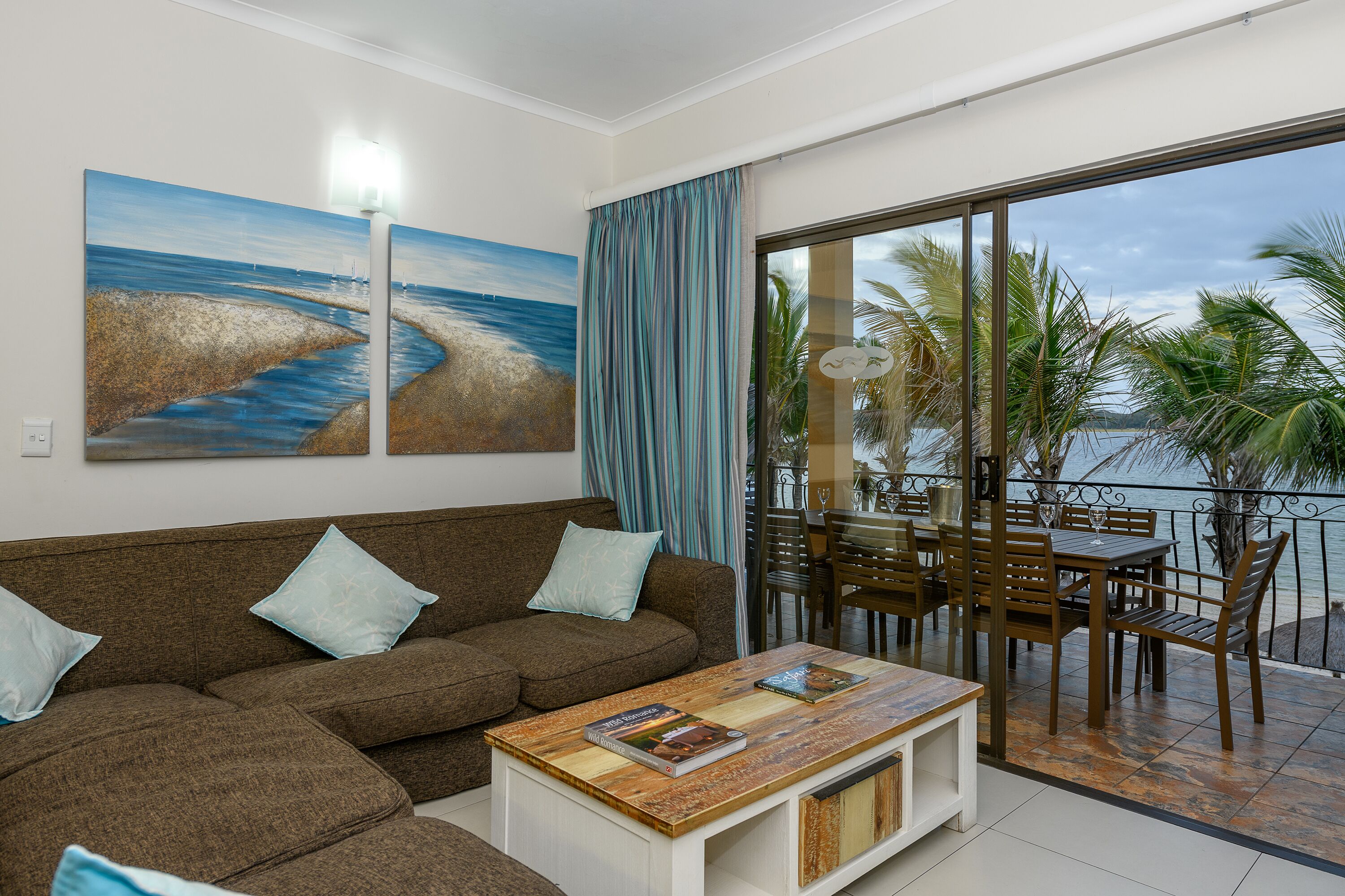 two bedroom beach front apartment | living area | 42-inch flat-screen tv with satellite channels, tv, ping pong