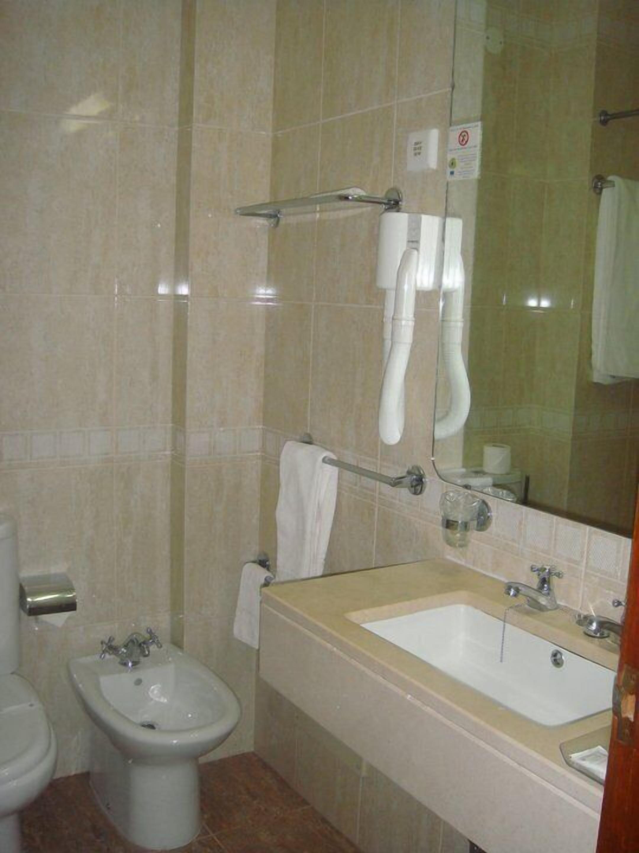 shower, hair dryer, slippers, bidet