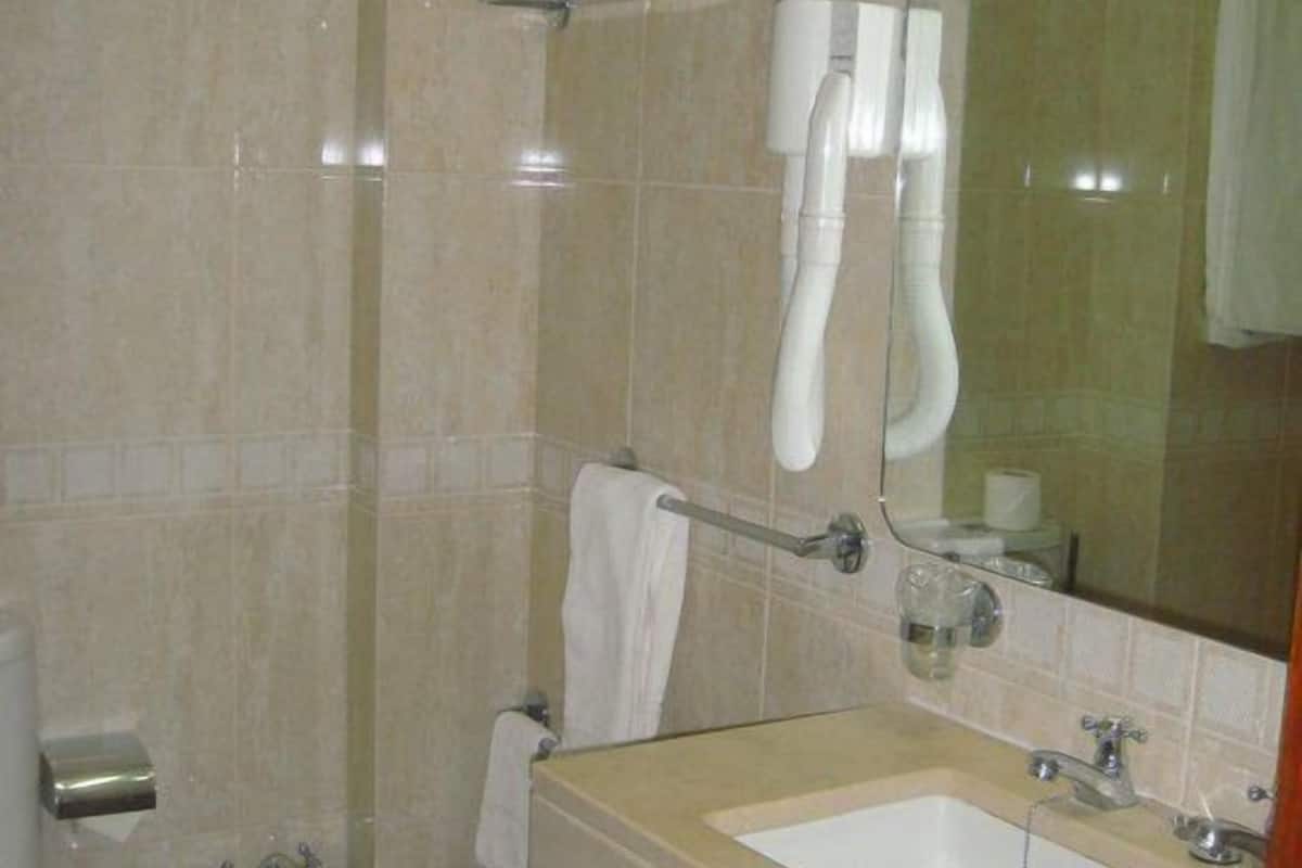 shower, hair dryer, slippers, bidet