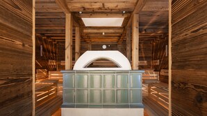 A sauna room with wooden walls and a bench. - Vitalhotel Samnaunerhof  (Samnaun)