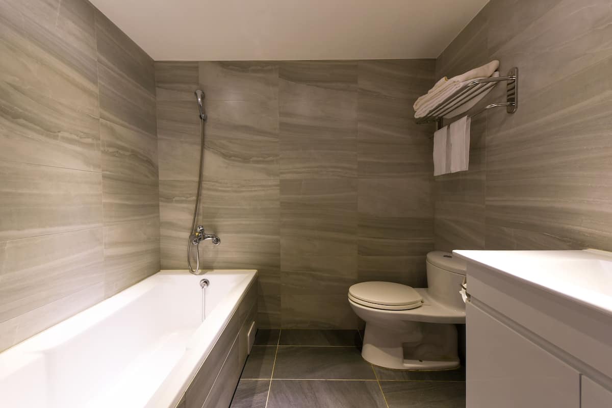 superior twin room | bathroom | free toiletries, hair dryer, slippers, towels