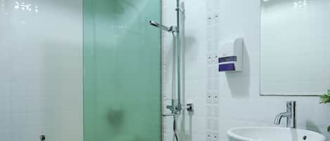 Junior Suite, 1 King Bed | Bathroom | Shower, rainfall showerhead, free toiletries, hair dryer