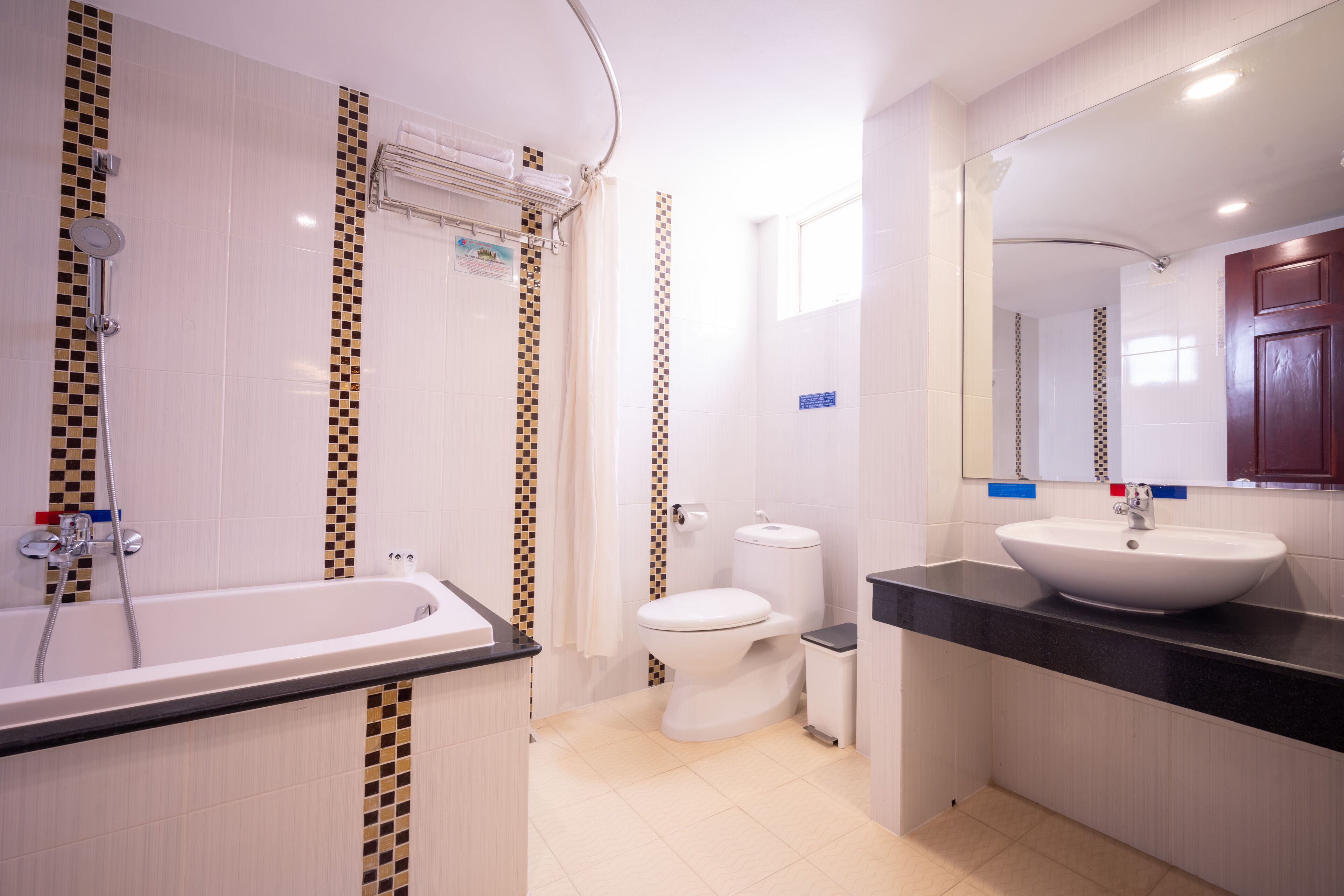 deluxe room | bathroom | designer toiletries, hair dryer, towels, soap