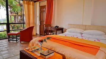 Premier Room, 1 King Bed, Garden View, Sea Facing | Desk, bed sheets