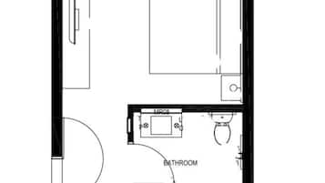A bedroom with a bed, a bathroom with a toilet and sink, and a closet with a mirror.