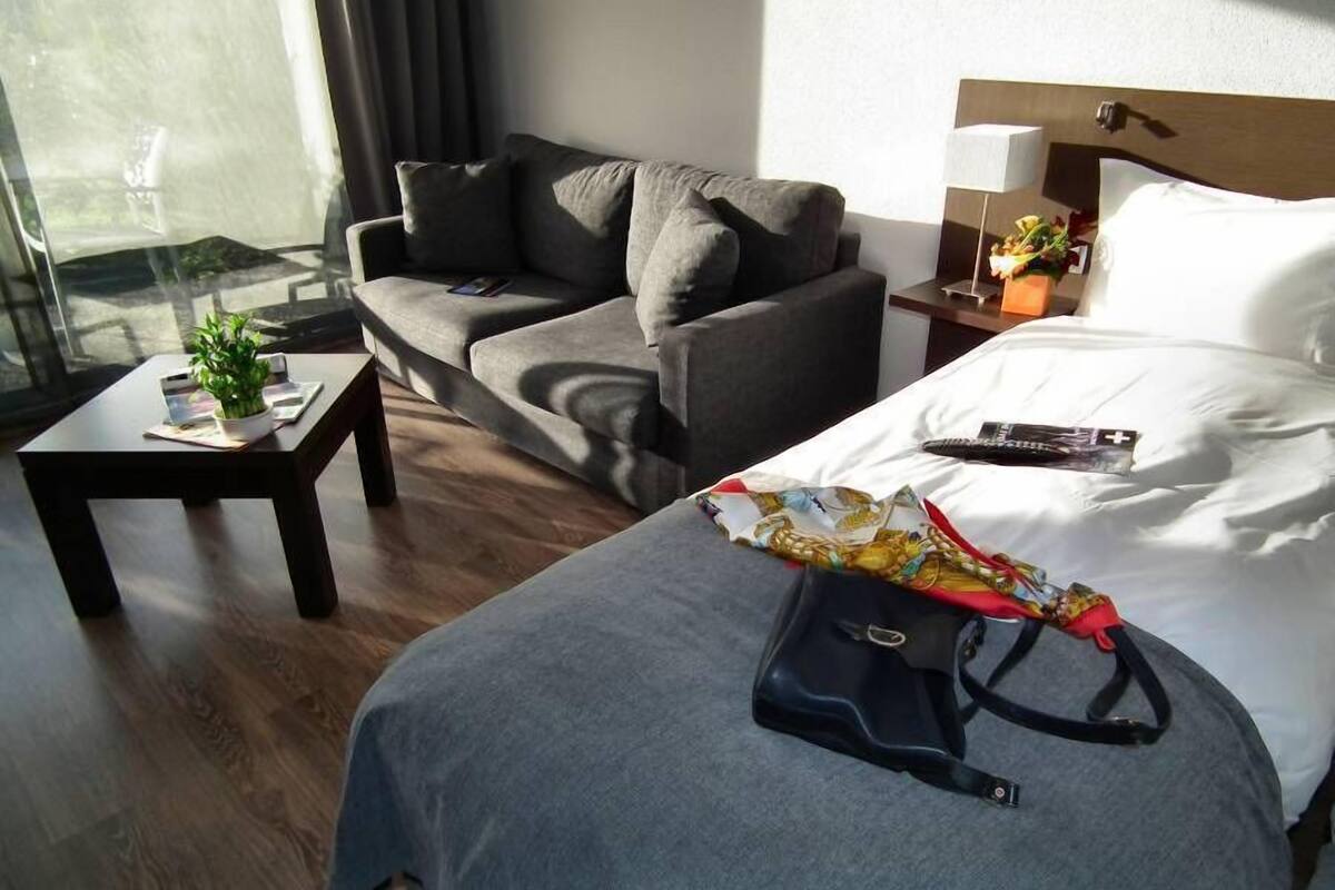 family room | premium bedding, minibar, in-room safe, desk