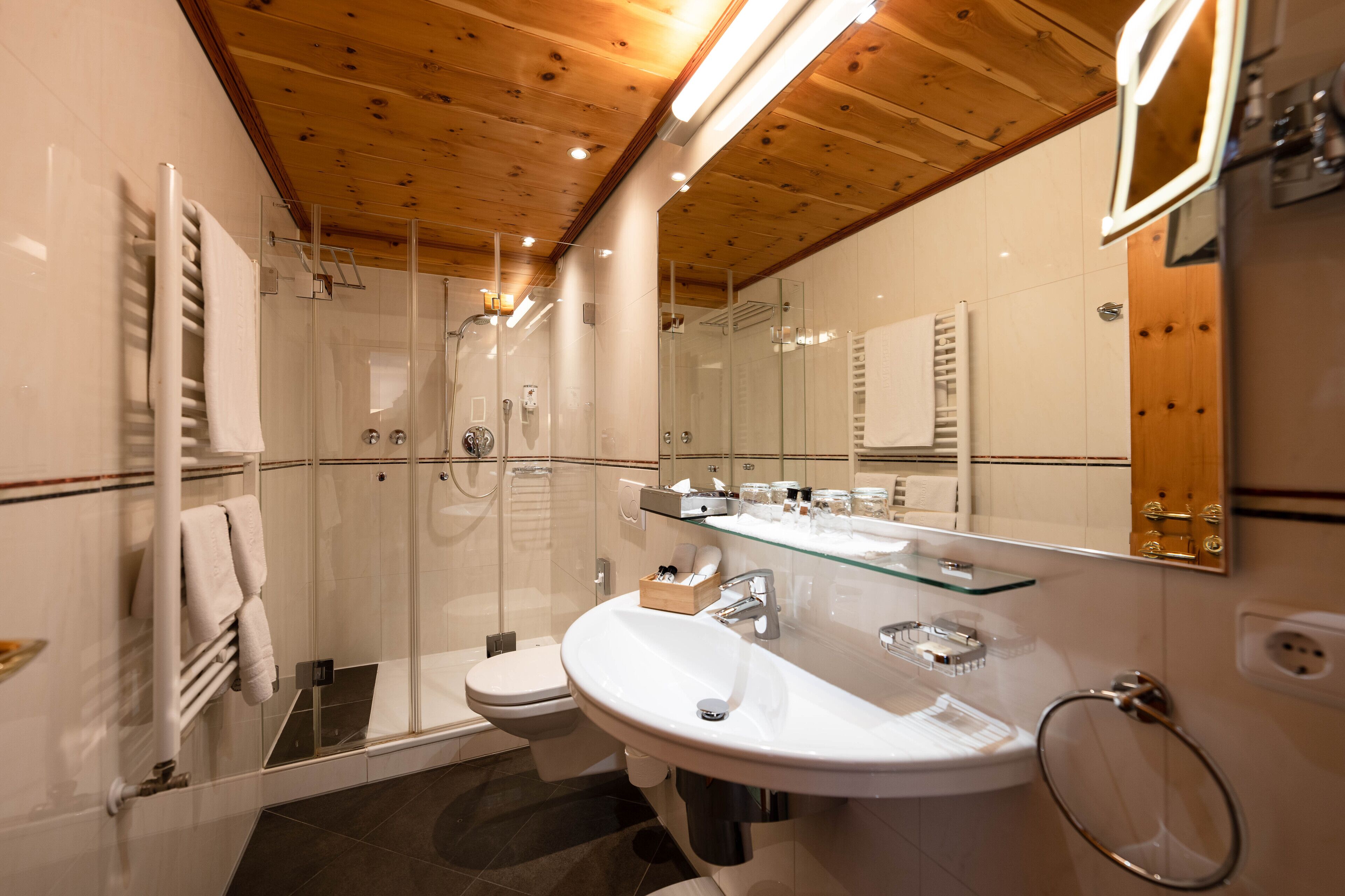 comfort suite | bathroom | shower, eco-friendly toiletries, hair dryer, bathrobes