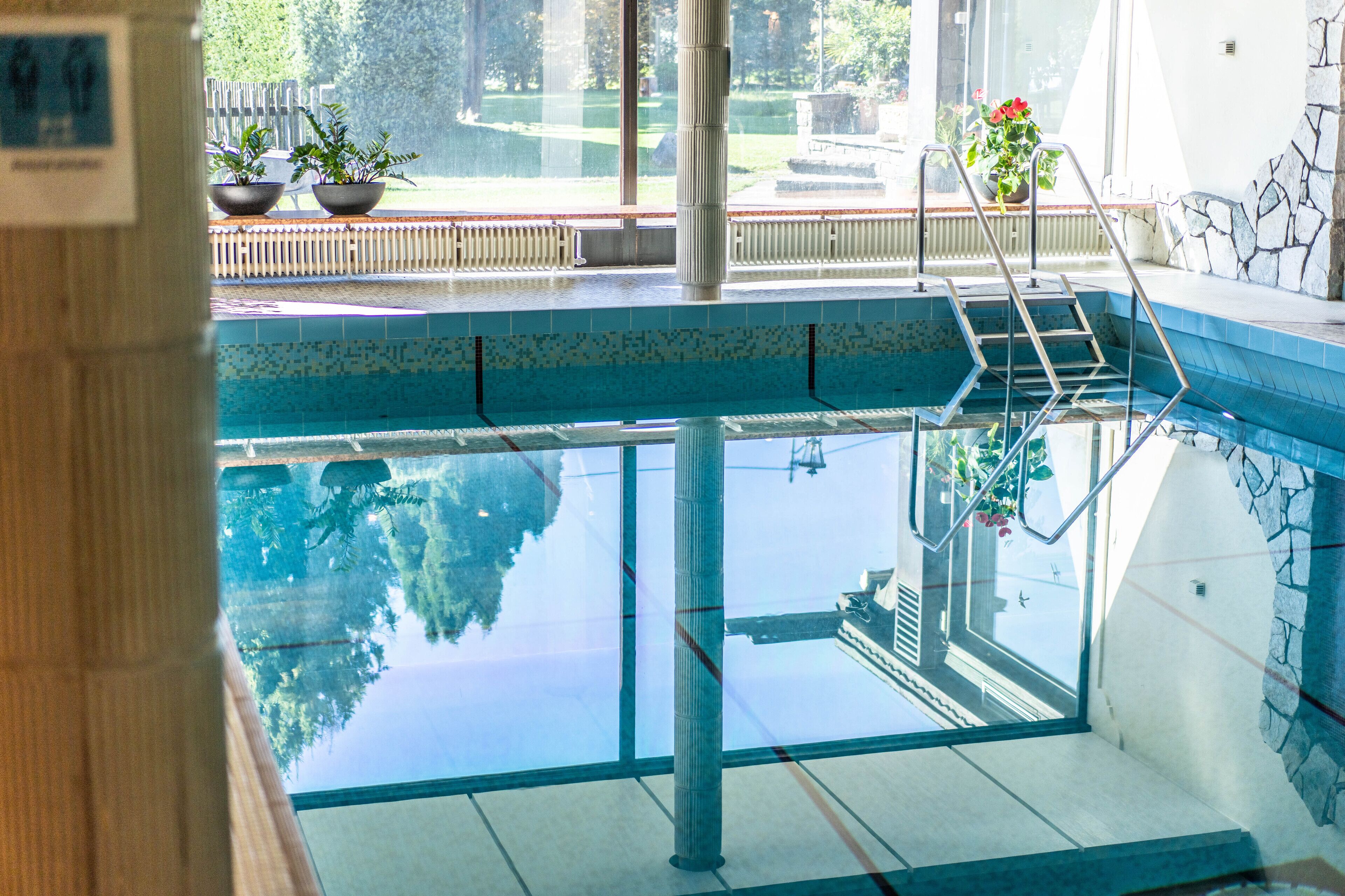 indoor pool, open 7:00 am to 8:00 pm, pool umbrellas, pool loungers