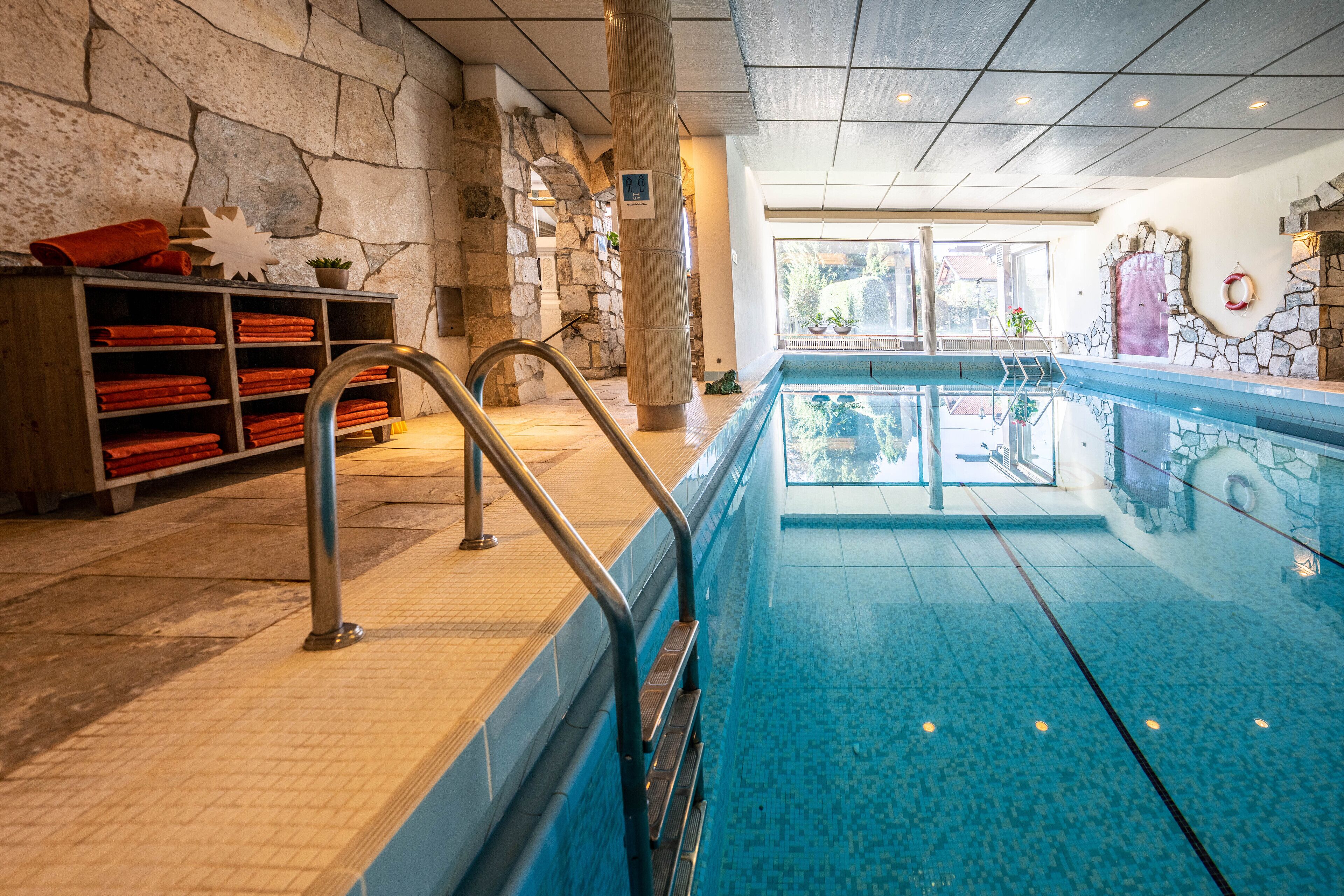 indoor pool, open 7:00 am to 8:00 pm, pool umbrellas, pool loungers