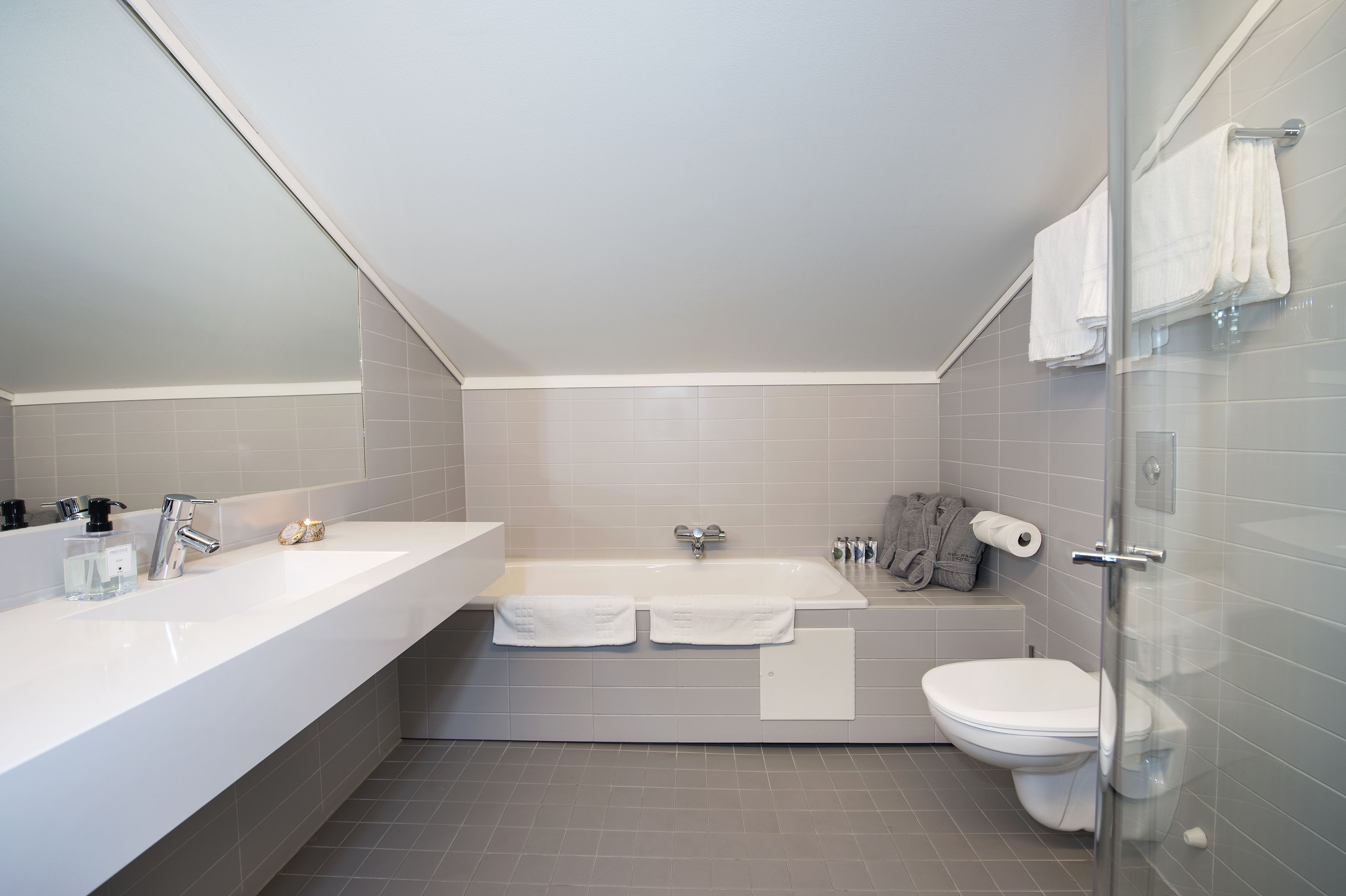 suite | bathroom | spring water bathtub, hair dryer, towels