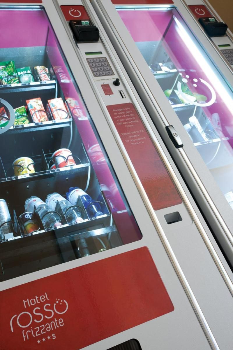 A vending machine with a variety of snacks and drinks, including chips and bottled beverages.