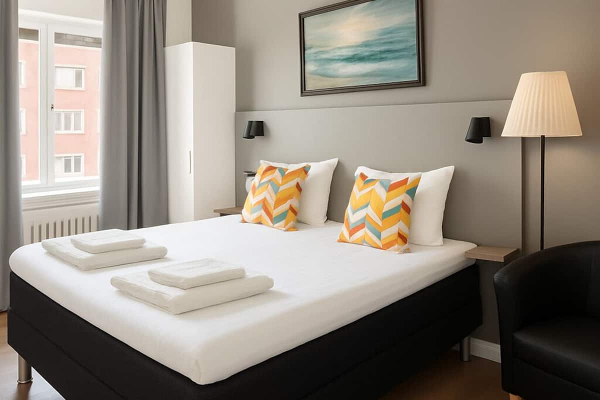 Habitación familiar | Cortinas blackout, camas extra, wifi gratis y ropa de cama