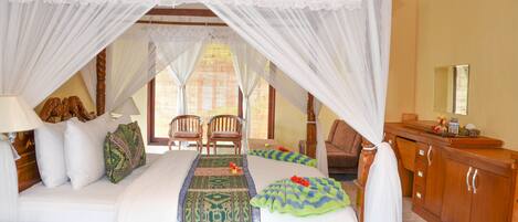 A bedroom with a canopy bed, wooden furniture, and a view of the outside through a window.