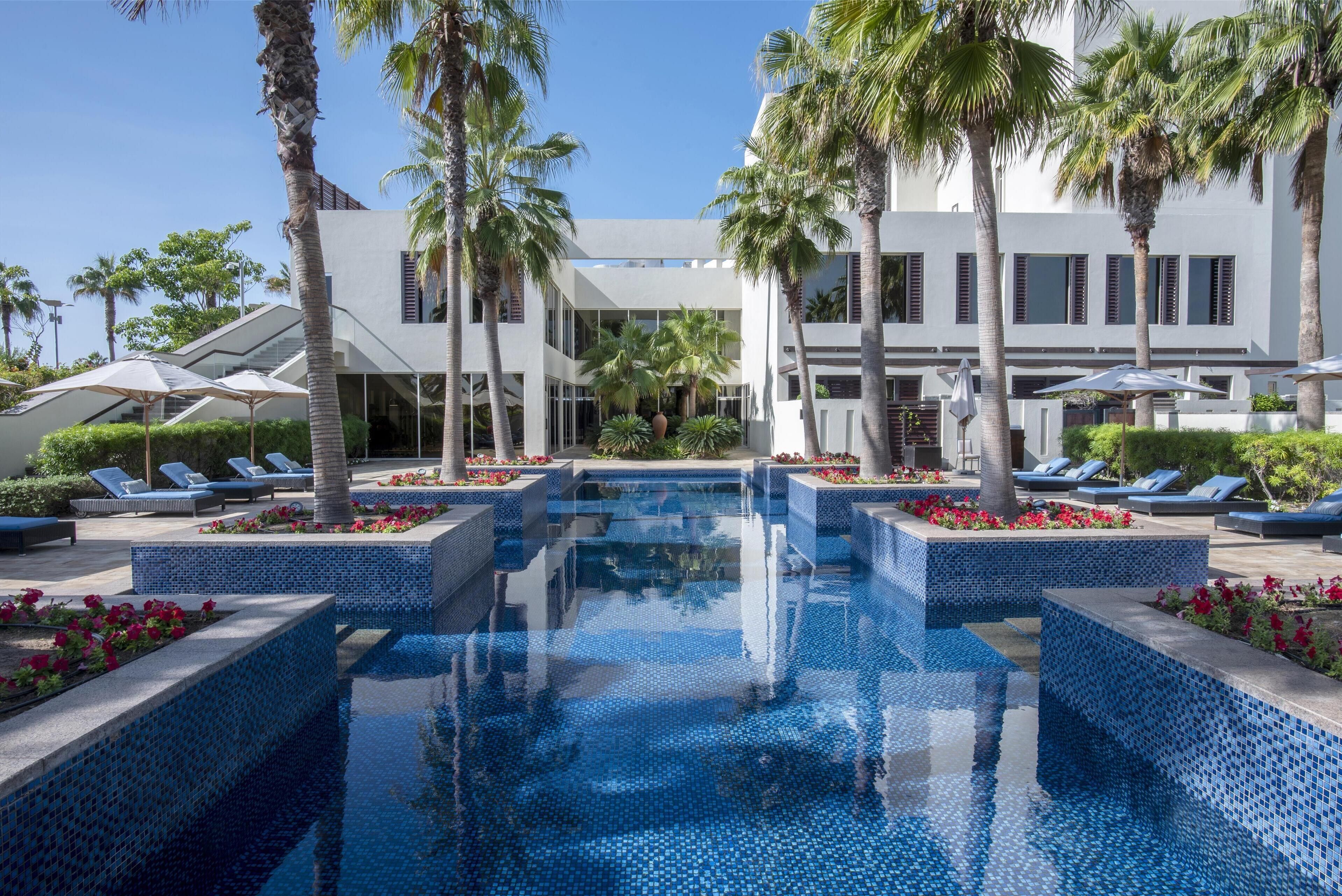 5 outdoor pools, pool umbrellas, pool loungers