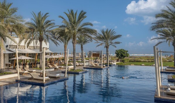 5 outdoor pools, pool umbrellas, pool loungers