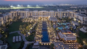 A hotel with multiple buildings, a swimming pool, and landscaped areas. - Park Hyatt Abu Dhabi Hotel & Villas (Abu Dhabi)