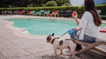 Seasonal outdoor pool, open 9:00 AM to 7:00 PM, pool umbrellas