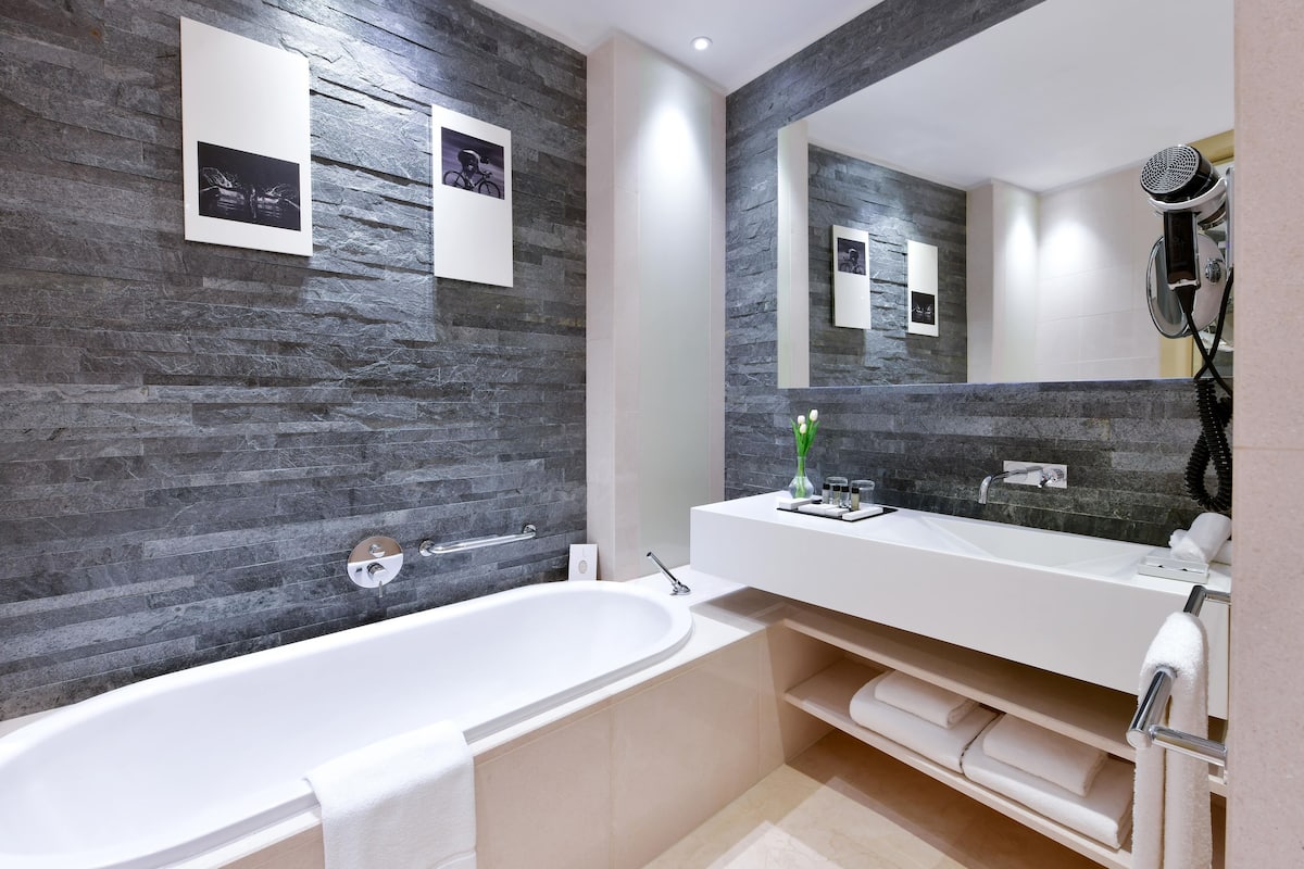 deluxe double room | bathroom | separate bathtub and shower, deep-soaking bathtub, rainfall showerhead