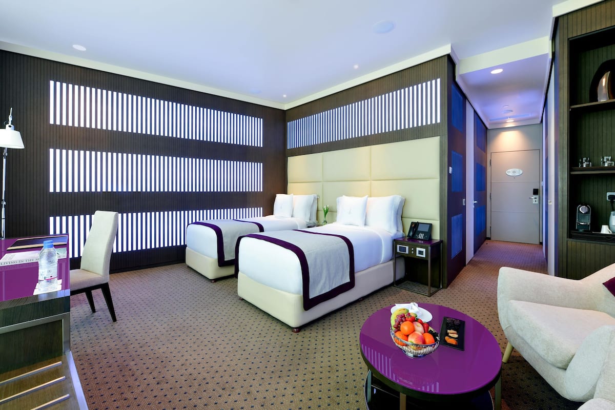 deluxe twin room | premium bedding, minibar, in-room safe, desk