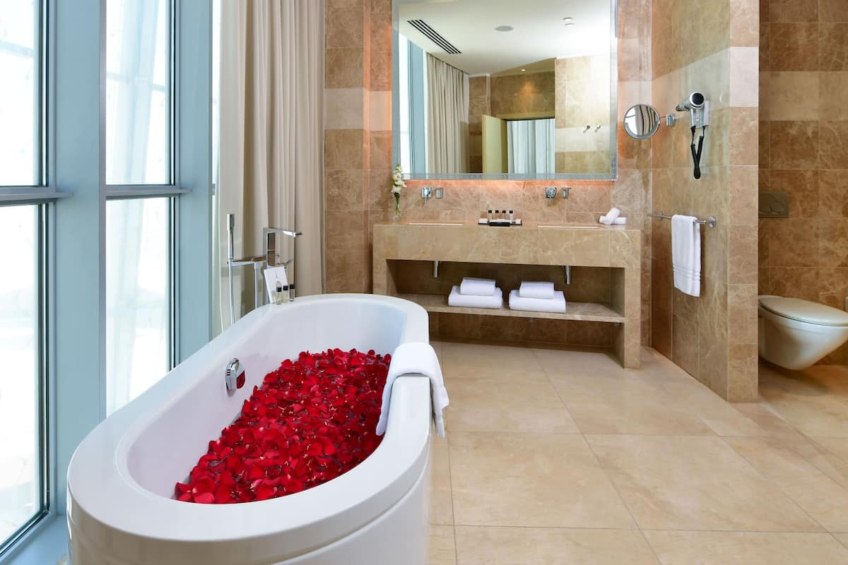 separate bathtub and shower, deep-soaking bathtub, rainfall showerhead