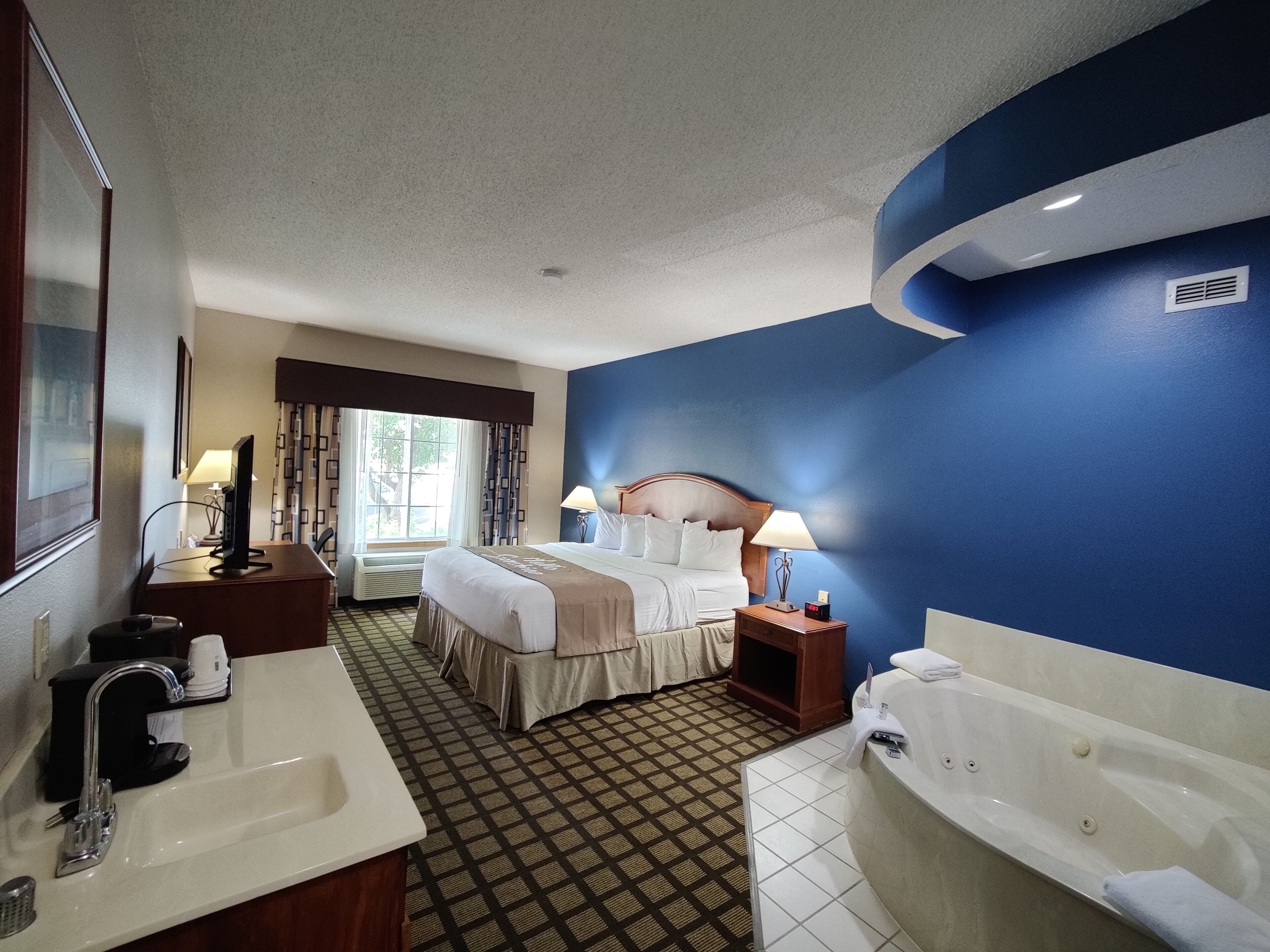 Suite, 1 King Bed, Non Smoking, Jetted Tub | In-room safe, iron/ironing board, free cribs/infant beds, rollaway beds