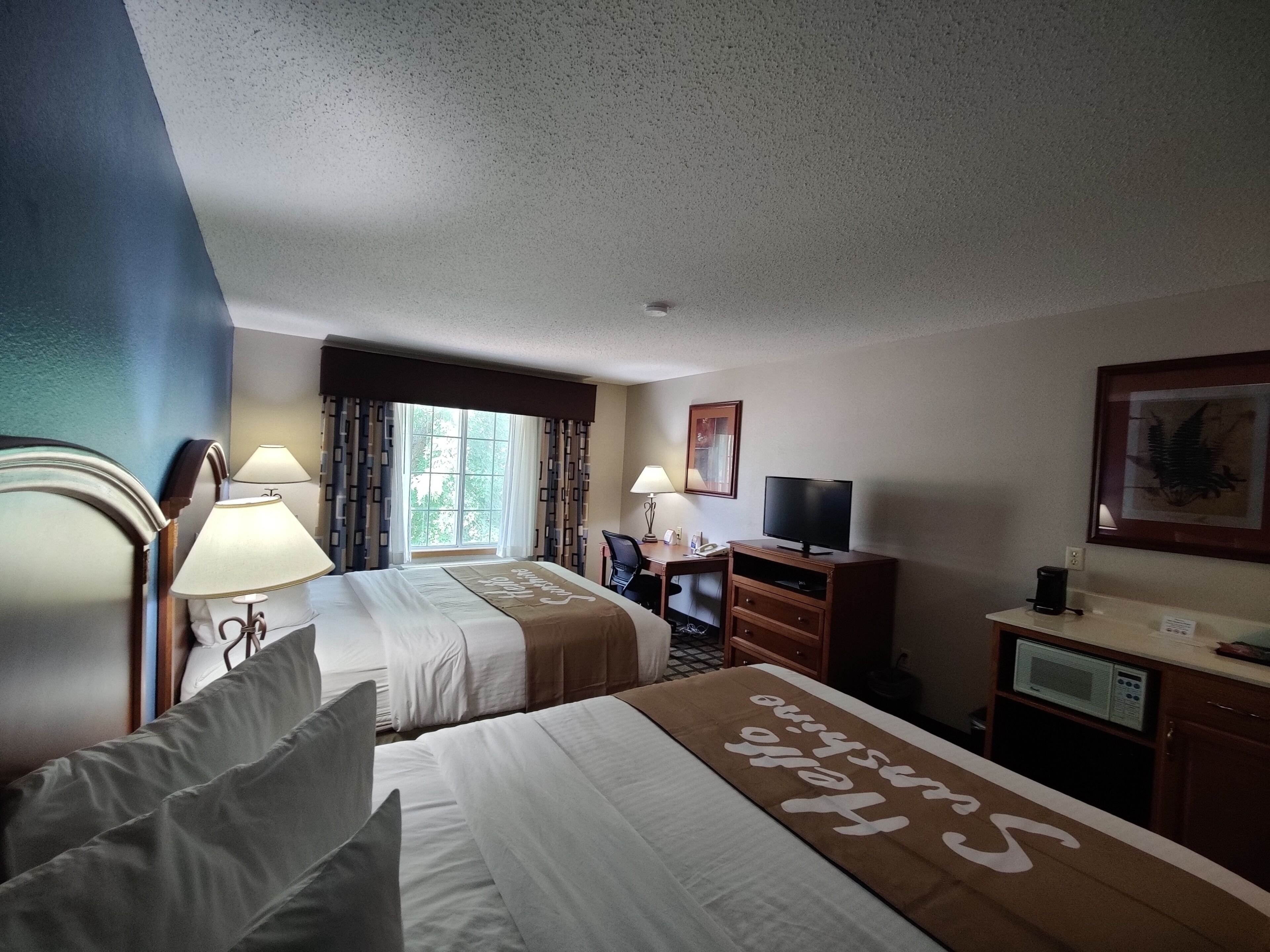 room, 2 queen beds, non smoking | in-room safe, iron/ironing board, free cots/infant beds, rollaway beds