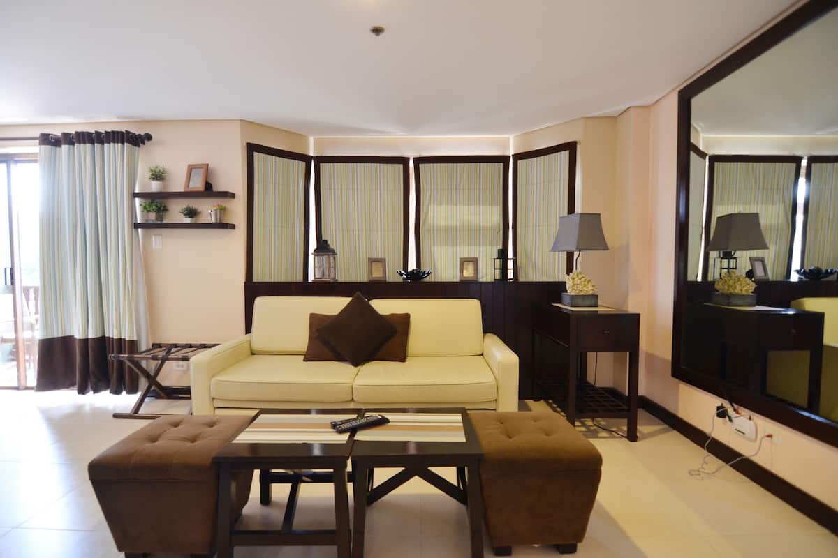One Bedroom Deluxe | Living room | LCD TV, DVD player